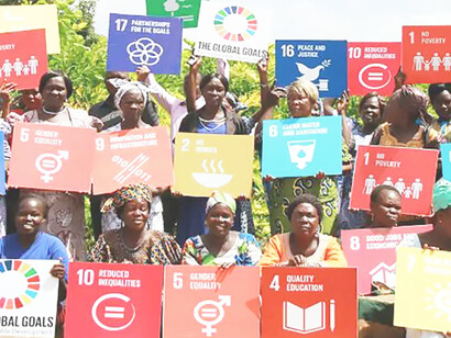 Families of the South Sudan region, holding the goals for sustainable development
