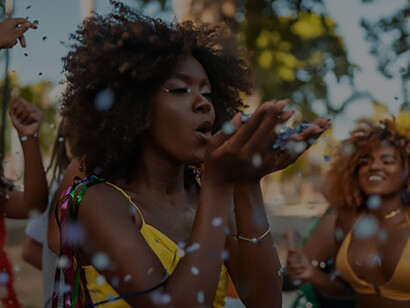 Lively street celebration with joyful Black women dancing and having fun