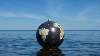 A fragile world adrift; where the fate of the planet floats between calm waters and an uncertain sky