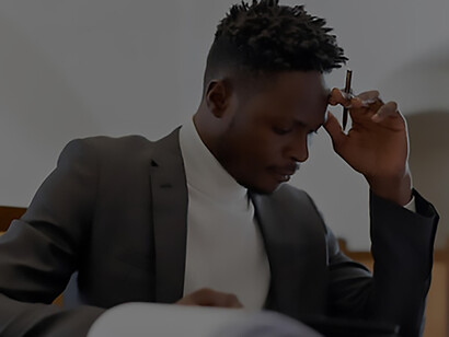 A businessman is diligently engaged in his work at the desk