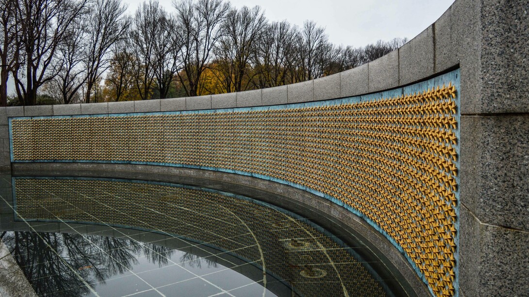Side view of the National World War Two Memorial Wall in Washington, DC, adorned with 4,048 gold stars; each represents 100 Americans who died during the Second World War