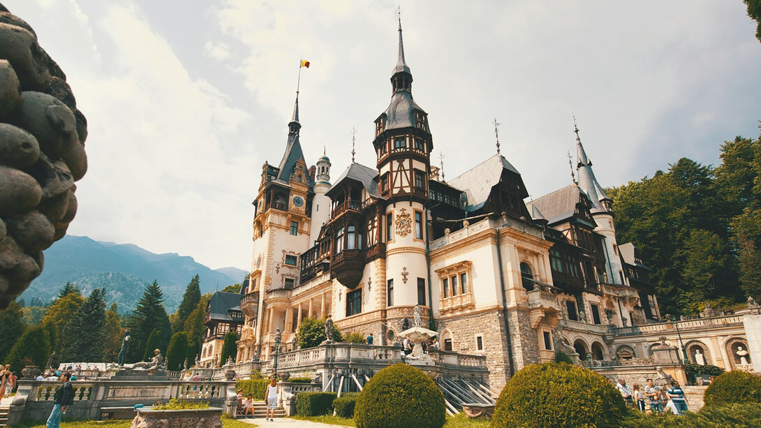 The majestic beauty of Peles Castle, a stunning architectural gem nestled in the heart of Romania's Carpathian Mountains