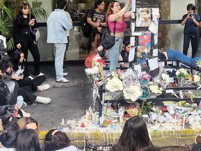 Fans gathered outside the Casa Sur Hotel in Buenos Aires' Palermo neighborhood, where Liam Payne tragically passed away, placing flowers and photos to honor his memory