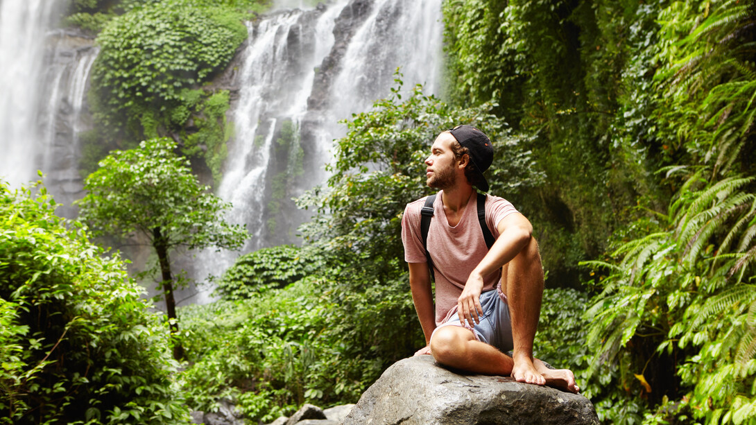 Surrounded by nature, he practices mindfulness, focusing on the present moment to clear his mind and reduce stress