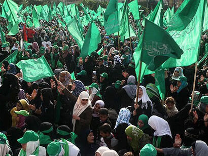 Women, men and children at a Hamas rally