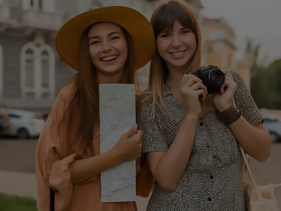 Stylish companions journeying across Europe adorned in spring dresses and accessories, blending fashion with exploration