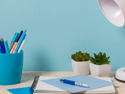 An organized study space with notebooks and essential materials on the desk, promoting focus and productivity