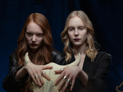 Shadows creep from two girl's eyes