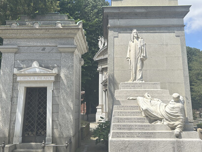Catholic section, its layout, located in Milan's Garibaldi district in Italy, emphasizes urban planning with symmetrically arranged areas and separate entrances for different faiths