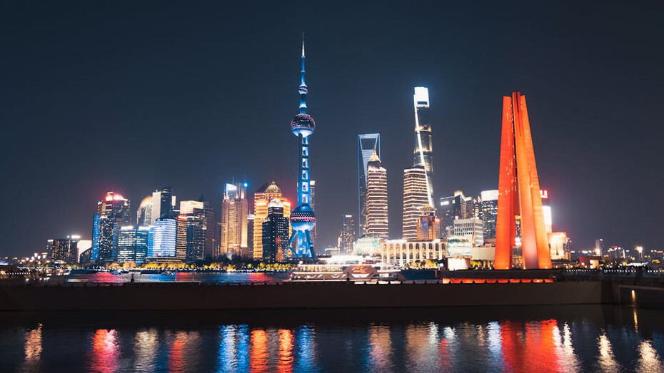 Shanghai's skyline at night dazzles with a riot of colors, showcasing a city that never sleeps and always shines bright