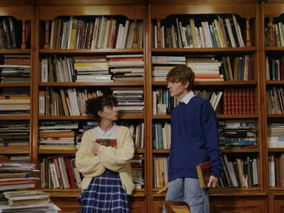 Amidst the shelves of knowledge, these university students ponder the need for innovation in research and education to meet humanity's pressing issues