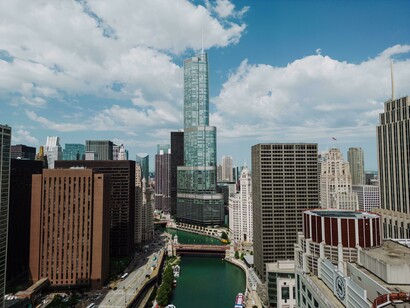 Trump Tower among other city skyscrapers and a river