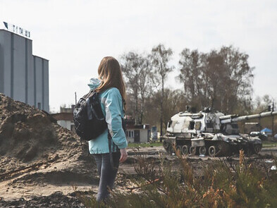 A young girl walking in Ukraine after Russian invasion