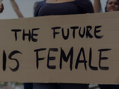 Advocating for gender equality: women proudly display a 'future is female' banner, embodying the spirit of feminist activism and empowerment