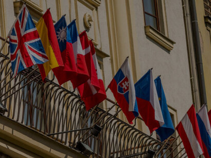 European country flags displayed in a row on a building, reflecting the Erasmus program's role in fostering European identity and promoting EU unity