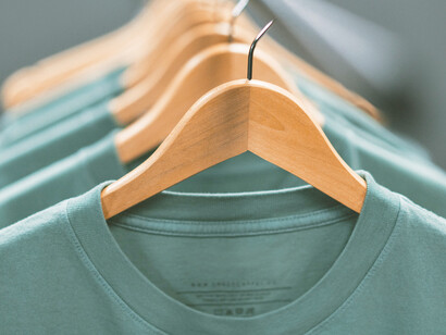 Wearing a curtain instead of a t-shirt may seem as improbable as the idea of hanging t-shirts in windows