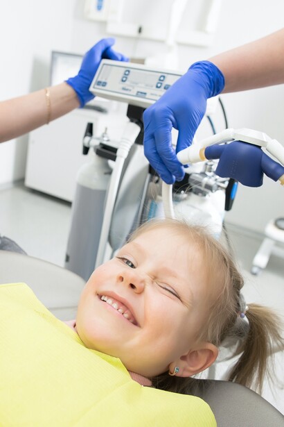 Young girl is excited and ready for her dental check up