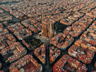 Aerial photography showcasing
La Sagrada Familia, the intricate city infrastructures and the distinctive rooftops of Barcelona