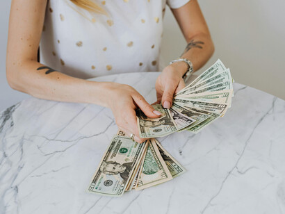 A woman counting US dollars