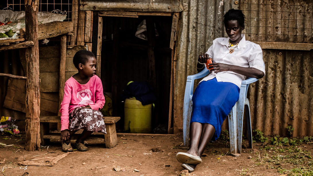The woman's intense stare speaks volumes about the unrecognised challenges that arise from living with both health issues and the relentless grip of poverty