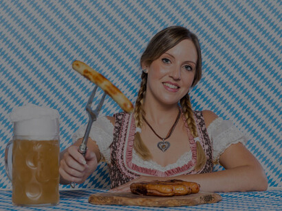 Bavarian sausages presented by a cheerful girl