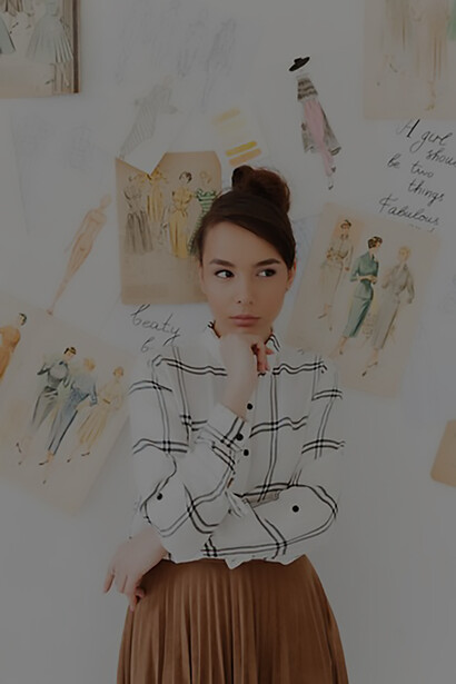 Creativity with a stunning image of a young fashion designer holding her sketchbook, showcasing her artistic vision and innovative designs