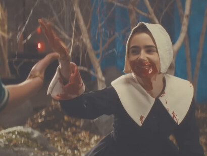 Lily Collins drenched in fake blood from MaXXXine