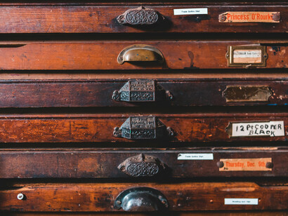 An old, worn file cabinet, filled with memories