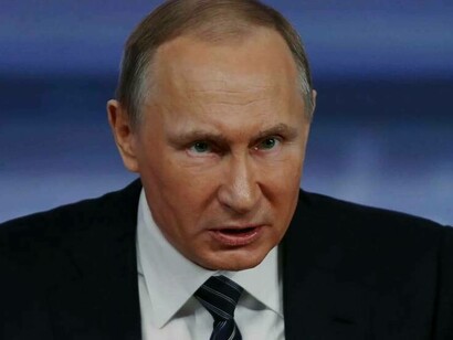 Russian President Vladimir Putin with angry eyes attempts to clarify his foreign policy on Russian television