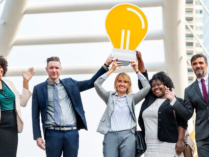 A team of interconnected business leaders brainstorming innovative ideas for multi-stakeholder initiatives