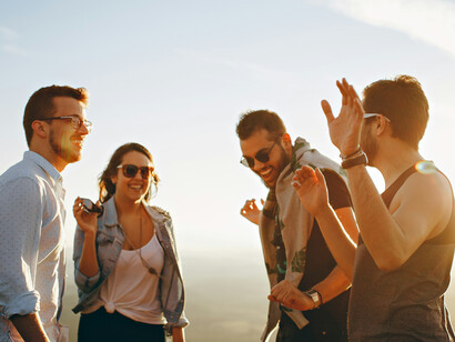 A group of people in an open field enjoying their social bonding; when people interact with their world and each other, they create some really fertile ground for change