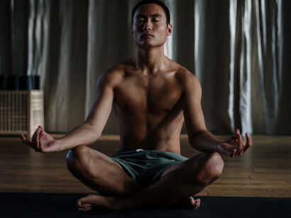 As he finds comfort in Sukhasana, the gentle stretch enhances flexibility and promotes a grounded sense of well-being