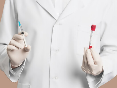 A dedicated doctor wearing a medical mask, skillfully holding a syringe and vacutainers, symbolizing the importance of precise medical procedures in healthcare settings