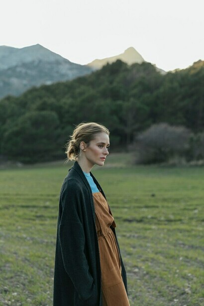 A woman embarks on a healing journey in nature, embracing self-discovery, overcoming emotional layers, and transforming her ego through inner growth and personal transformation