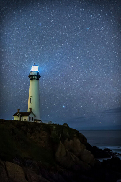 A peaceful lighthouse in the dark invites introspection