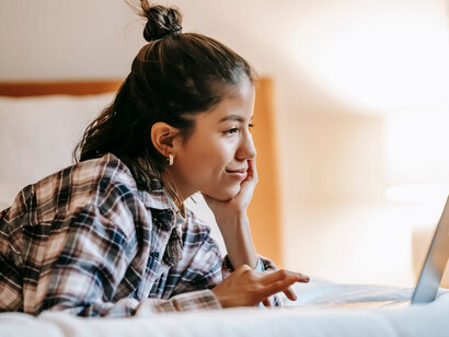 With a beaming smile, she embraces the soothing power of kind words, finding solace in memories of a digital companion who truly understood her