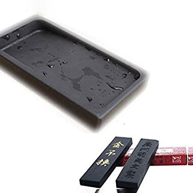 Ink stones are typically made of a fine, dark, solid natural stone that is flat and smooth, with portion to hold ink