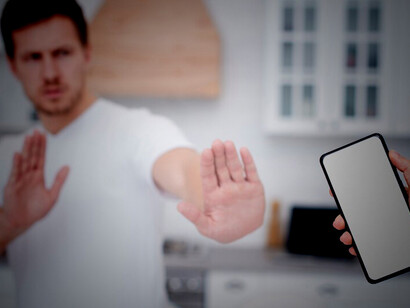 The man is committed to a digital detox, actively avoiding phone use to reduce screen time