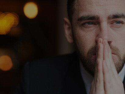 Visual portrayal of sorrow and mourning: distressed man crying, grieving loss, and expressing emotional pain