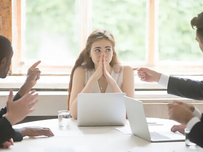 Workplace dynamics: a woman marginalized and demeaned by male coworkers, shedding light on persistent gender biases in professional settings
