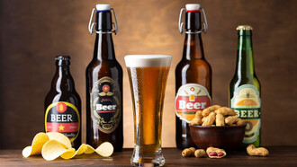 A snack of chips and peanuts arranged in front of beer bottles, perfect for a relaxed evening