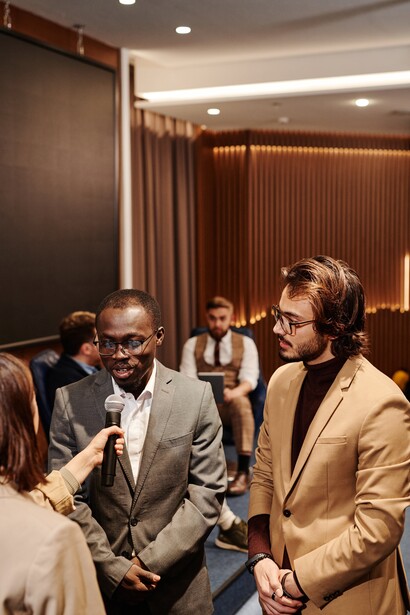 People being interviewed at a conference. We are facing inequality within our countries, and dramas on the world scale