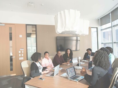 A meeting amongst colleagues to discuss the important issues regarding solely what pertains to the business regarding the workplace