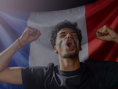 Joyous atmosphere showcasing a cheering man waving the French flag, embodying national pride and celebration at its finest