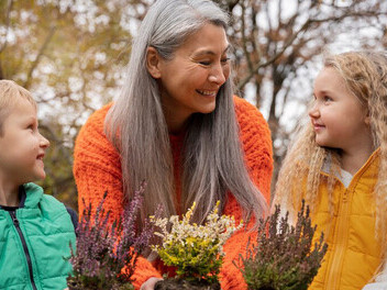 Children engage with an adult mentor, discovering the importance of environmental stewardship through hands-on learning and exploration