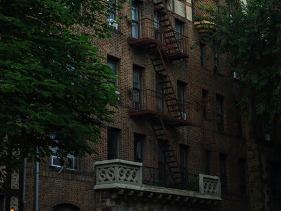 Red brick and vertical windows are a fundamental of the urban landscape of Brooklyn, USA