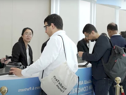 Attendees are arriving at the Investment Exhibition at AIM Congress 2024 in Abu Dhabi, UAE