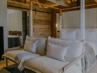 A room in the Cheese Barn, a unique space where guests can immerse themselves in the art of cheese-making, surrounded by the rich aromas and flavors of local dairy products, United Kingdom