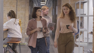 Colleagues engage in lively discussions, showcasing the vibrant energy that fuels a productive workplace