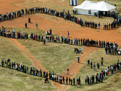 People queue to cast their votes at a polling station in the Katlehong township, east of Johannesburg, during South Africa's fourth democratic elections on the 22nd of April, 2009